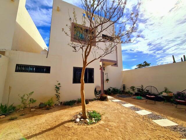 Puerto Los Cabos Csl N-E Of19:Genral GREAT INVESTMENT OPPORTUNITY - ENDLESS POSSIBILITIES!Discover the untapped potential of Casa Altezza, a spacious single-family home nestled in a sought-after residential community in northern Cabo San Lucas, conveniently located off Highway 19 and Tamaral Ave. What sets this property apart? THE LARGEST LOT! in its phase, offering unique development potential! Expand the current home, add residential rental-rooms, design a covered garage, or build the ultimate entertainment space with seamless access--this property's extra land is a blank canvas for creativity and investment. Completed in April 2022, Casa Altezza features 3 bedrooms and 2.5 bathrooms, including an ensuite bath in the master bedroom. The home boasts a spacious front patio with mature plants and trees, along with a private back patio with partial concrete flooring.Several thoughtful upgrades include: - Custom-designed kitchen with a modern, minimalist concept and an expanded window for ample natural light. - Enclosed bonus room for laundry and storage. - High 2.5-meter privacy walls surrounding the property. - Iron-protected doors and windows with installed screens. - Abundant water supply with a total of 23,700 liters, including two cisterns and a rooftop water tank. - New appliances, including a full-size washer & dryer, stove, hood, refrigerator, two inverter mini-splits, and ceiling fans.Casa Altezza sits in an ideal location, just 10 minutes from downtown Cabo San Lucas, Medano Beach, Puerto Paraiso Mall, and The Marina. Daily conveniences like supermarkets, shopping centers, medical facilities, and schools are just minutes away. Plus, the community is a gated neighborhood with electronic access, and a remarkably low HOA monthly fee of only – EXPANSIVE LOT, Cabo San Lucas, BS