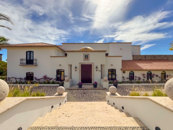 Puerto Los Cabos Fundadores Step into Villa Andaluz where Old-World romance meets Mexican charm. This sprawling 12,000+ AC sq.ft. estate redefines the classic Mexican hacienda. Centered around a lush, tiled courtyard with a tranquil stone fountain, this 7-bedroom, 9-bathroom villa offers an expansive floor plan designed for seamless indoor-outdoor living.The heart of the home features a grand living room with ocean – 206 Av. Padre Kino, San Jose del Cabo, BS